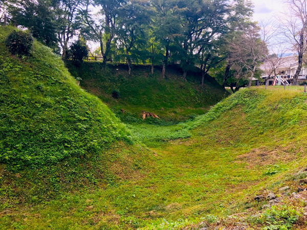 Nagashino Castle’s dry moats and earthen ramparts.